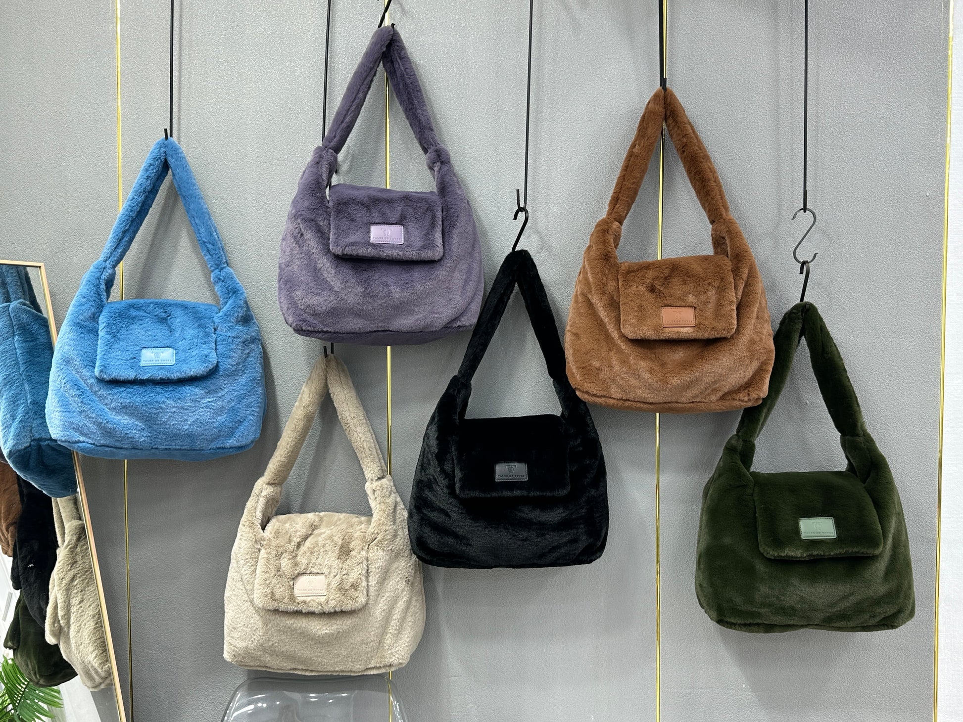 Soft faux fur tote bag with padded handles, front flap pocket, and zippered main compartment – designed for cozy winter style and functional everyday use. Spacious enough for essentials like cosmetics, wallet, and phone. A trendy winter accessory from Tales of Totes, offering stylish comfort beyond Indian brands like Zouk, Chumbak, and Miraggio."

