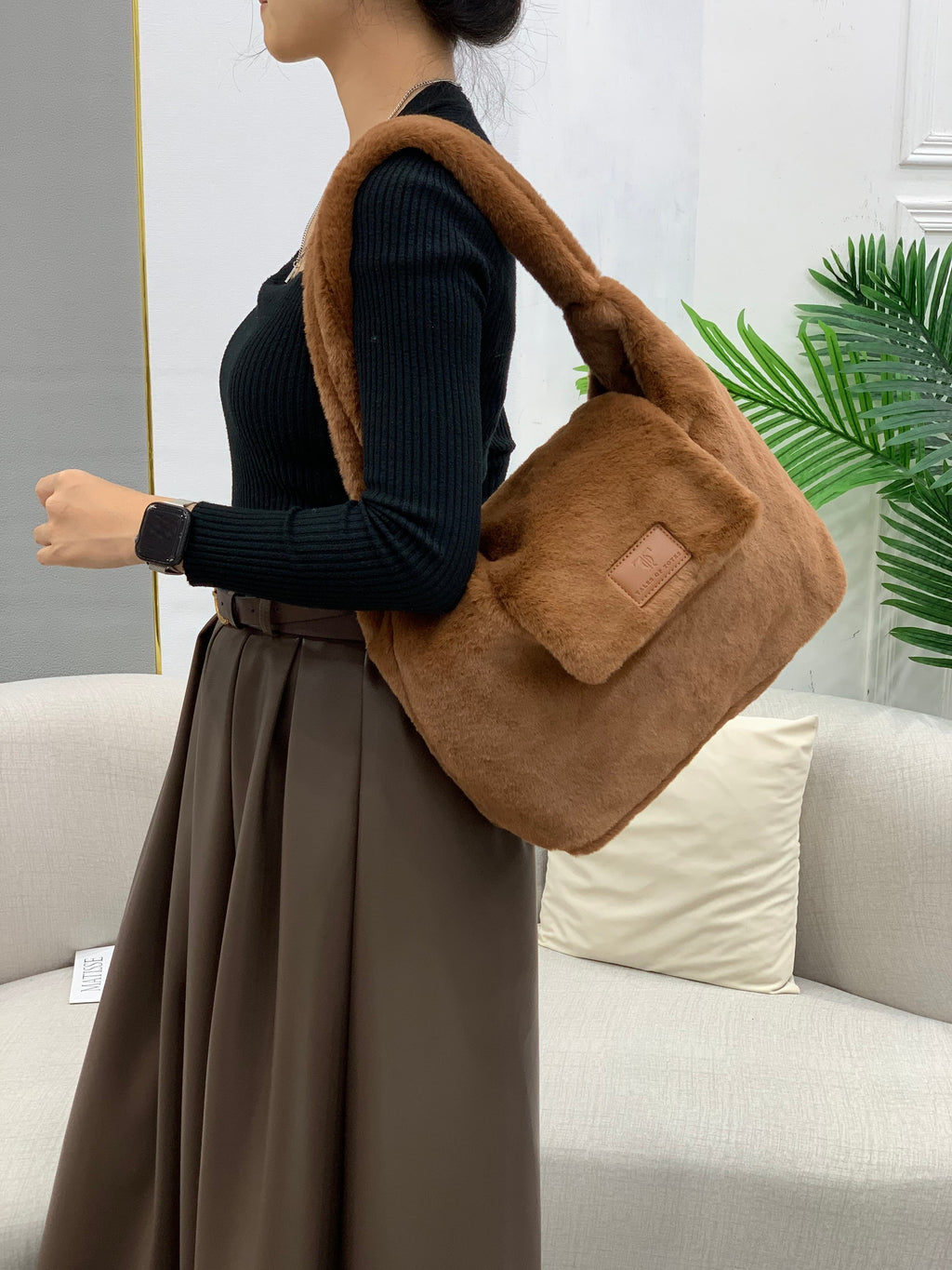 Soft faux fur tote bag with padded handles, front flap pocket, and zippered main compartment – designed for cozy winter style and functional everyday use. Spacious enough for essentials like cosmetics, wallet, and phone. A trendy winter accessory from Tales of Totes, offering stylish comfort beyond Indian brands like Zouk, Chumbak, and Miraggio."

