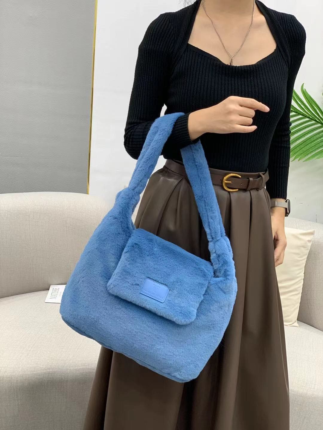 Soft faux fur tote bag with padded handles, front flap pocket, and zippered main compartment – designed for cozy winter style and functional everyday use. Spacious enough for essentials like cosmetics, wallet, and phone. A trendy winter accessory from Tales of Totes, offering stylish comfort beyond Indian brands like Zouk, Chumbak, and Miraggio."

