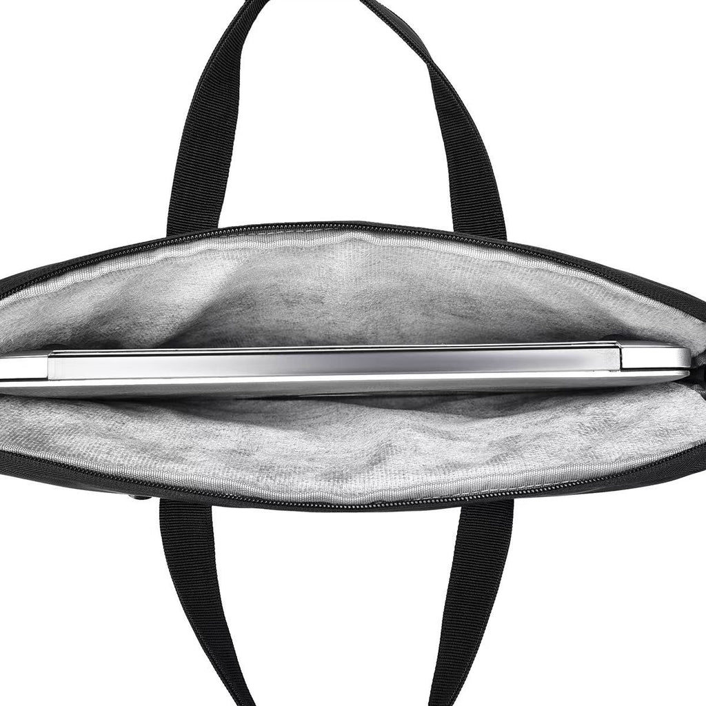 Black bag with a silver pen inside on a white background Black laptop office tote bag for men and women by Tales of Tote, premium faux leather formal bag designed for Indian professionals — sleek, minimalist, lightweight, padded laptop compartment, ideal for work, meetings, hybrid jobs, gifting, and daily commute. Stylish work tote with zipper closure, dual handles, and waterproof finish. Unisex corporate tote for executives, startup founders, students, and remote workers. Best office bag India 2025. Perfec