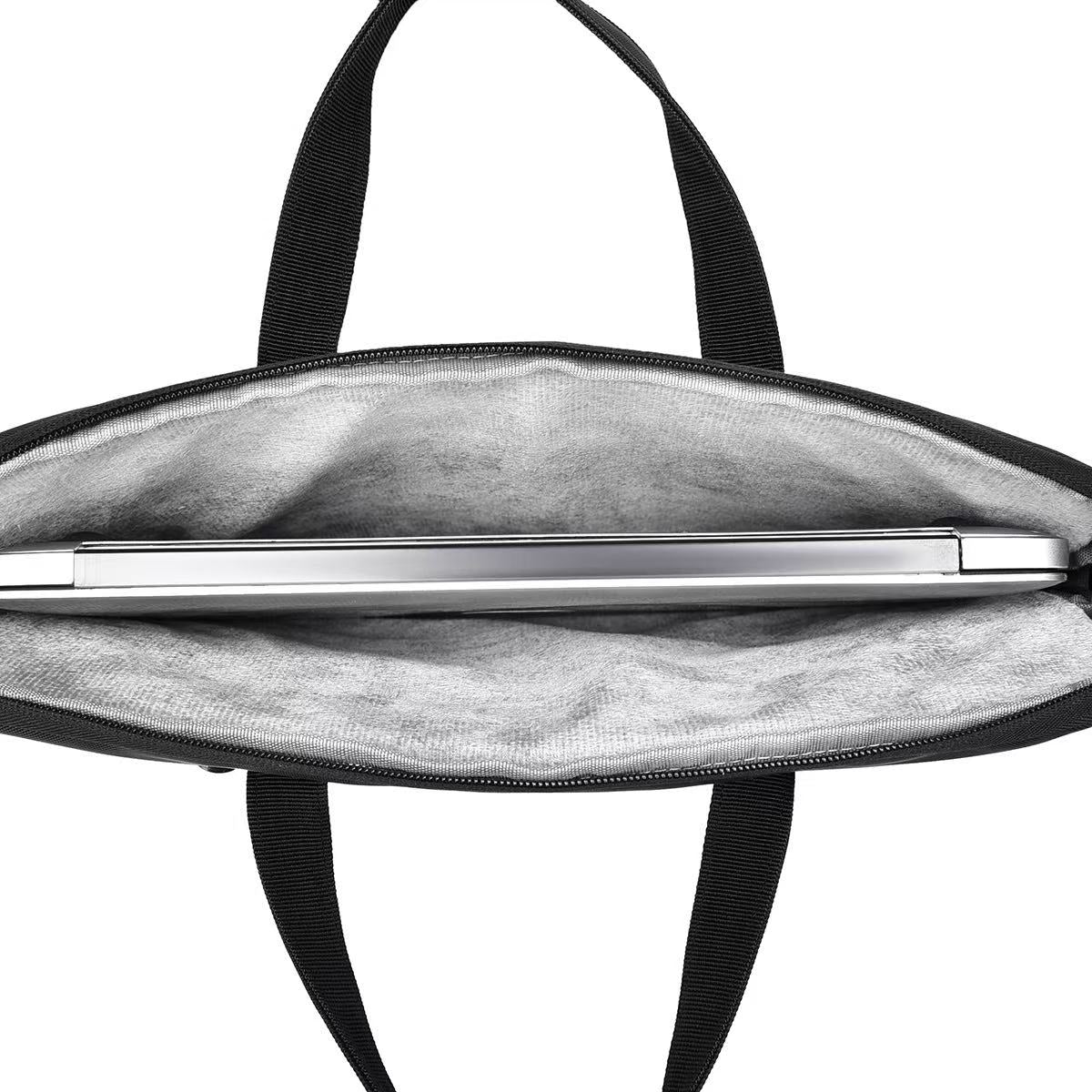 Black bag with a silver pen inside on a white background Black laptop office tote bag for men and women by Tales of Tote, premium faux leather formal bag designed for Indian professionals — sleek, minimalist, lightweight, padded laptop compartment, ideal for work, meetings, hybrid jobs, gifting, and daily commute. Stylish work tote with zipper closure, dual handles, and waterproof finish. Unisex corporate tote for executives, startup founders, students, and remote workers. Best office bag India 2025. Perfec