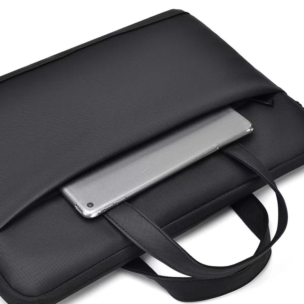 Black laptop bag with a silver laptop inside on a white background Black laptop office tote bag for men and women by Tales of Tote, premium faux leather formal bag designed for Indian professionals — sleek, minimalist, lightweight, padded laptop compartment, ideal for work, meetings, hybrid jobs, gifting, and daily commute. Stylish work tote with zipper closure, dual handles, and waterproof finish. Unisex corporate tote for executives, startup founders, students, and remote workers. Best office bag India 20
