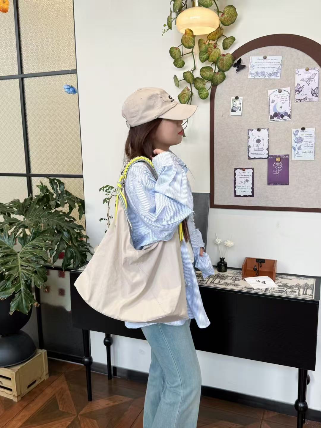 Person wearing a beige cap and light blue shirt with a beige tote bag in an indoor setting.,Person holding a gray tote bag in an indoor setting,“Trendy tote bag for women in India with spacious design, inner pocket, and rope handle strap – perfect everyday alternative to Zara tote bags, H&M shopper bags, Mango handbags, Charles & Keith totes, Lifestyle handbags, Myntra handbags, and Fabindia casual totes.”