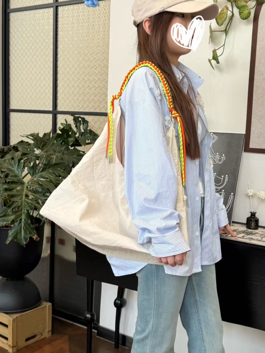 Person holding a beige tote bag with colorful straps in an indoor setting Person holding a gray tote bag in an indoor setting,“Trendy tote bag for women in India with spacious design, inner pocket, and rope handle strap – perfect everyday alternative to Zara tote bags, H&M shopper bags, Mango handbags, Charles & Keith totes, Lifestyle handbags, Myntra handbags, and Fabindia casual totes.”
