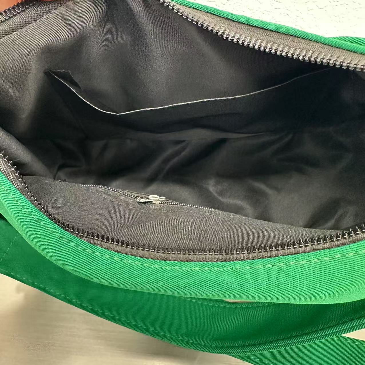 Trendy emerald green crescent half-moon shoulder bag for women, durable canvas, versatile for daily use, ethnic wear, and casual outings in India. This stylish sling bag offers a modern minimalist design, spacious interior, functioning as a chic carryall or small hobo tote.
