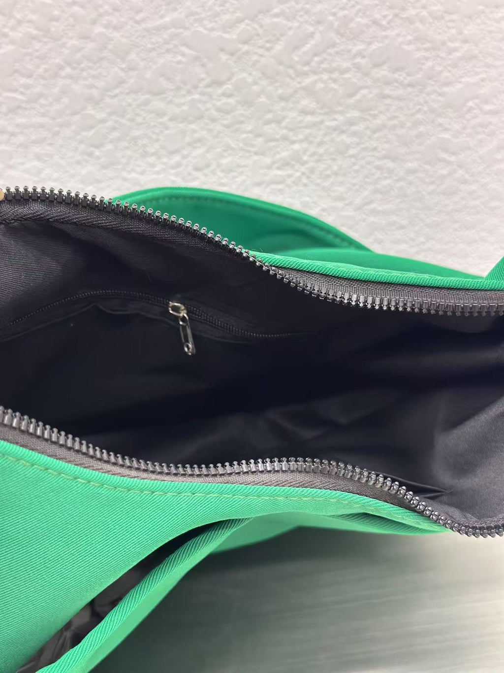 Trendy emerald green crescent half-moon shoulder bag for women, durable canvas, versatile for daily use, ethnic wear, and casual outings in India. This stylish sling bag offers a modern minimalist design, spacious interior, functioning as a chic carryall or small hobo tote.