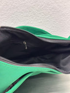 Trendy emerald green crescent half-moon shoulder bag for women, durable canvas, versatile for daily use, ethnic wear, and casual outings in India. This stylish sling bag offers a modern minimalist design, spacious interior, functioning as a chic carryall or small hobo tote.