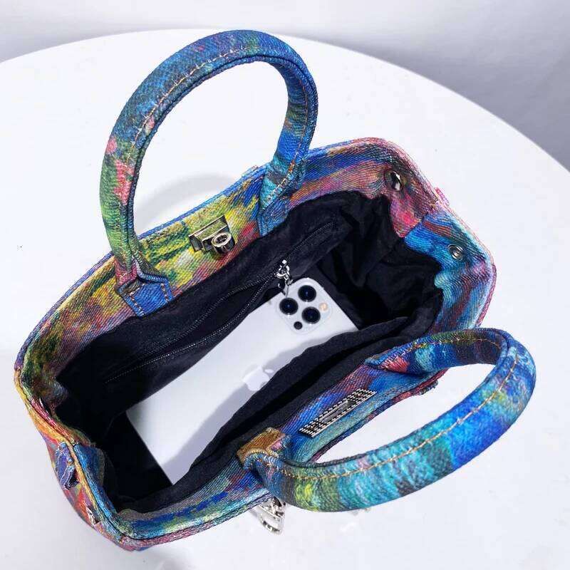 Colorful handbag with a phone inside on a white background
