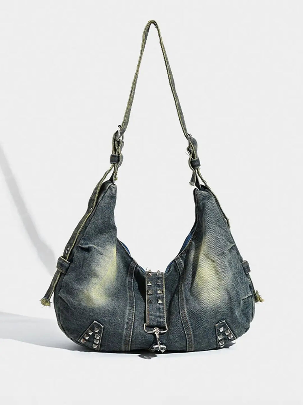Denim handbag with studded details on a white background