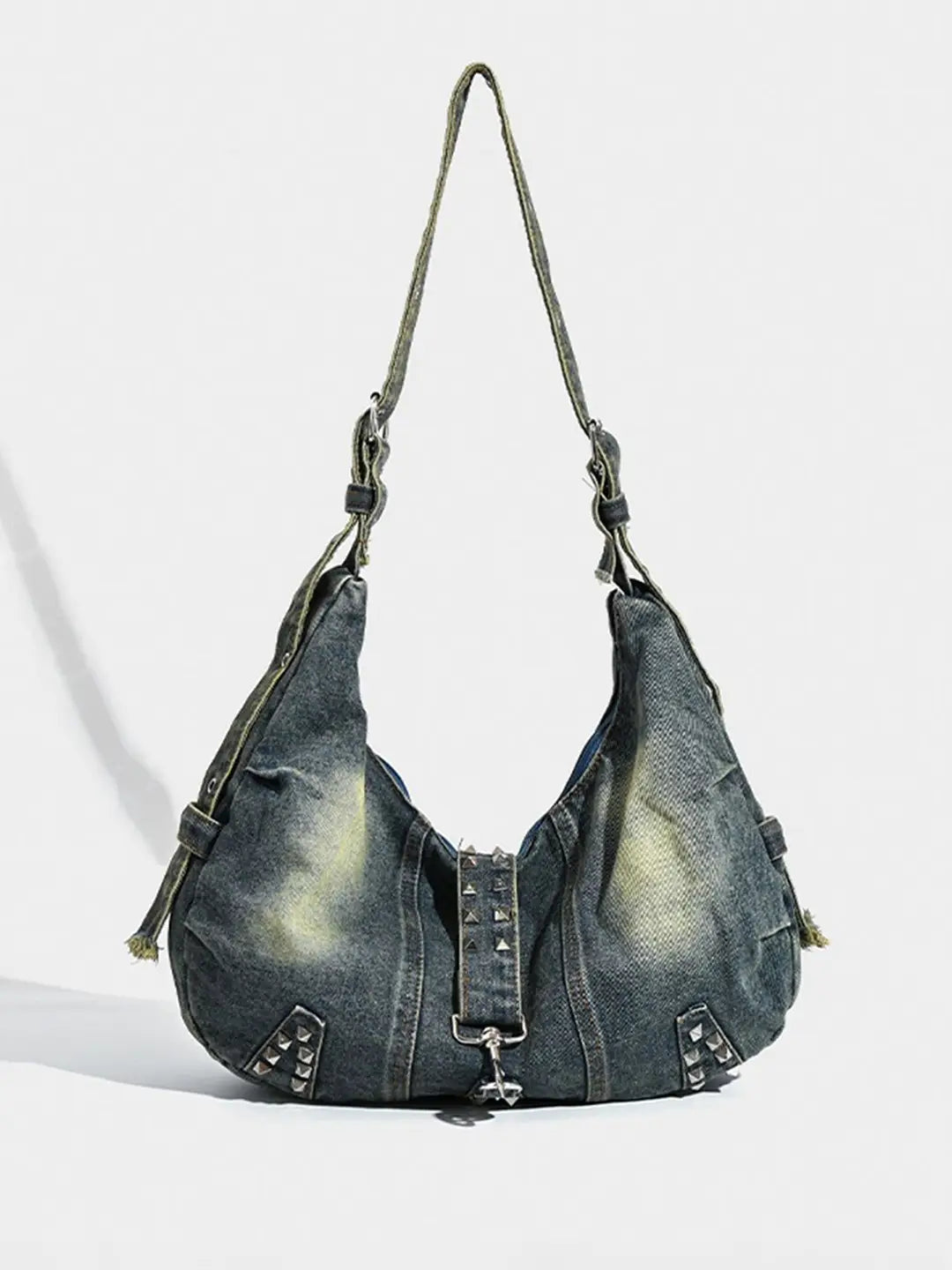 Denim handbag with studded details on a white background