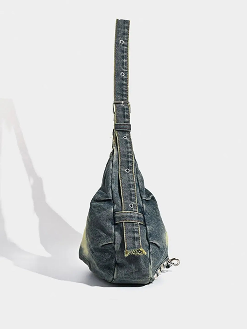 Denim sling bag on a white background