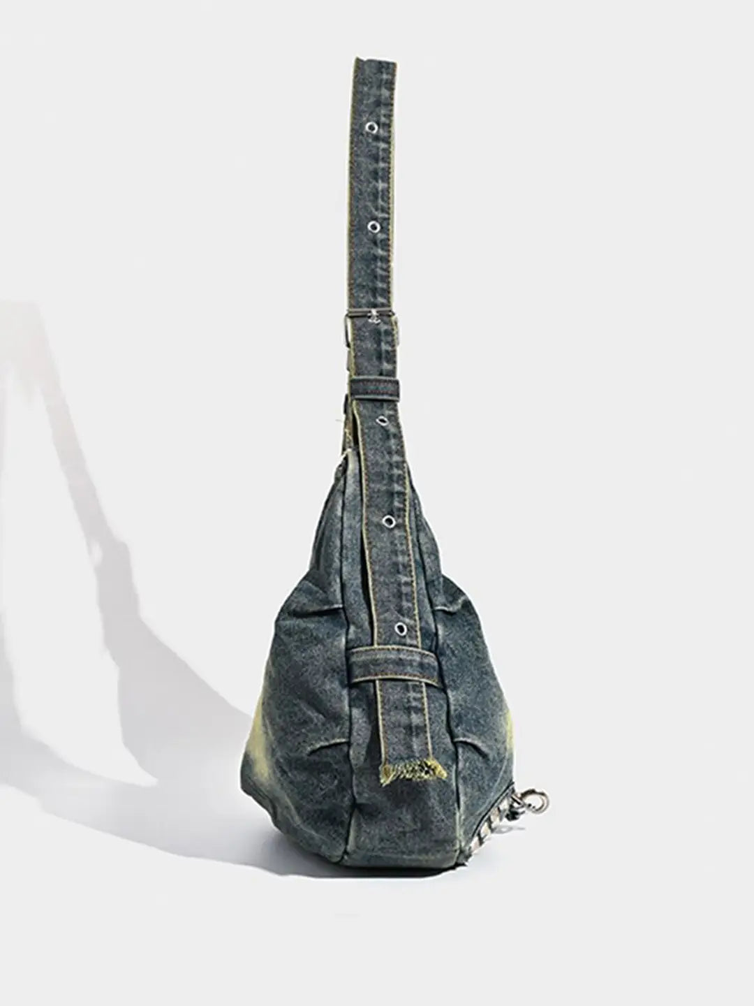 Denim sling bag on a white background