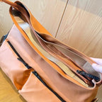 Brown backpack on a white background,A padded, water-resistant shoulder bag with a roomy interior, zip closure, and adjustable strap, designed for everyday carry and positioned as a stylish alternative to popular Indian brands like Zouk, Miraggio, Lavie, Caprese, and DailyObjects.