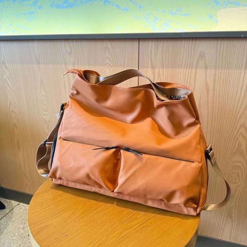 Brown backpack on a white background,A padded, water-resistant shoulder bag with a roomy interior, zip closure, and adjustable strap, designed for everyday carry and positioned as a stylish alternative to popular Indian brands like Zouk, Miraggio, Lavie, Caprese, and DailyObjects.