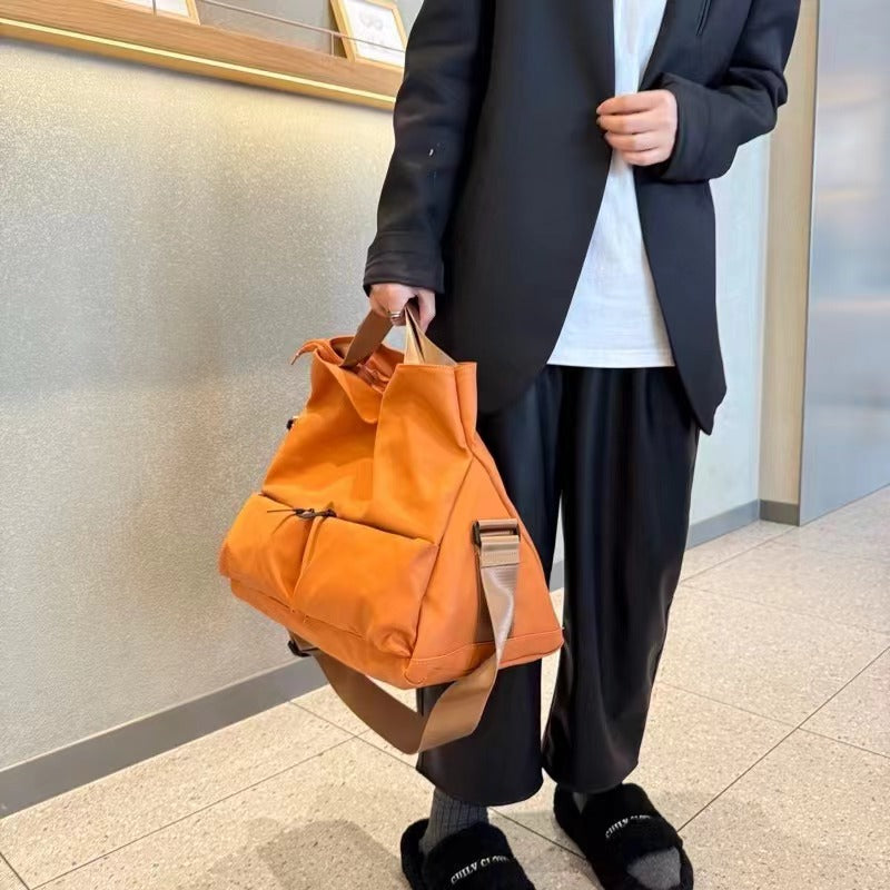 Brown backpack on a white background,A padded, water-resistant shoulder bag with a roomy interior, zip closure, and adjustable strap, designed for everyday carry and positioned as a stylish alternative to popular Indian brands like Zouk, Miraggio, Lavie, Caprese, and DailyObjects.