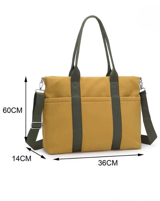 Yellow bag with black straps and measurements on a white background