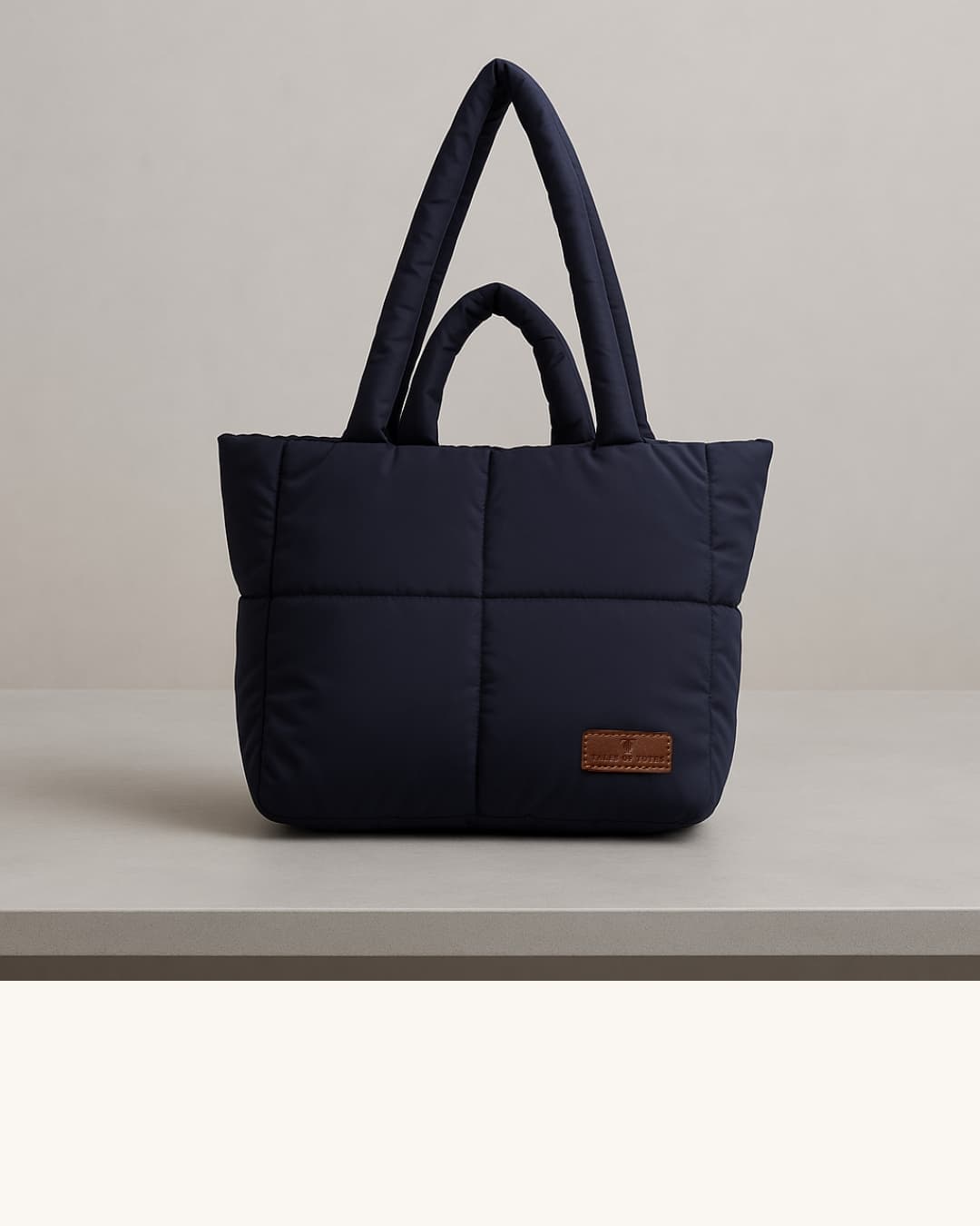 Stylish quilted puffer tote bag with padded handles and box-stitched detailing – ultra-lightweight, roomy, and perfect for everyday use. Ideal for college, shopping, or casual streetwear looks. A trendy fashion essential from Tales of Totes, offering cozy-chic appeal beyond standard canvas bags on Indian platforms like Myntra, Flipkart, and Amazon."