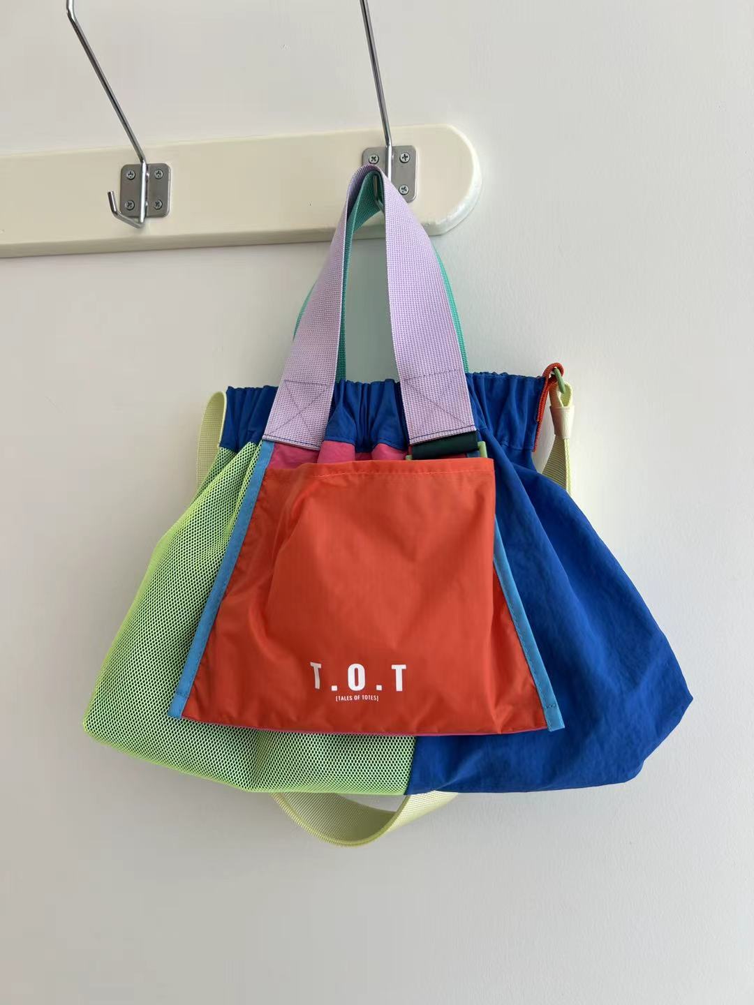 Trendy multi-color casual college tote bag with mesh detailing and adjustable straps.