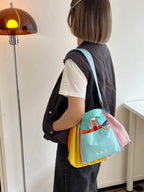Trendy multi-color casual college tote bag with mesh detailing and adjustable straps.