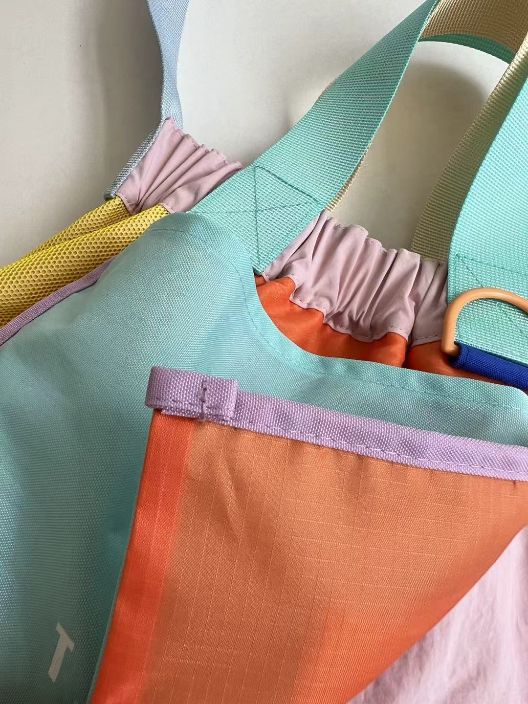 Trendy multi-color casual college tote bag with mesh detailing and adjustable straps.