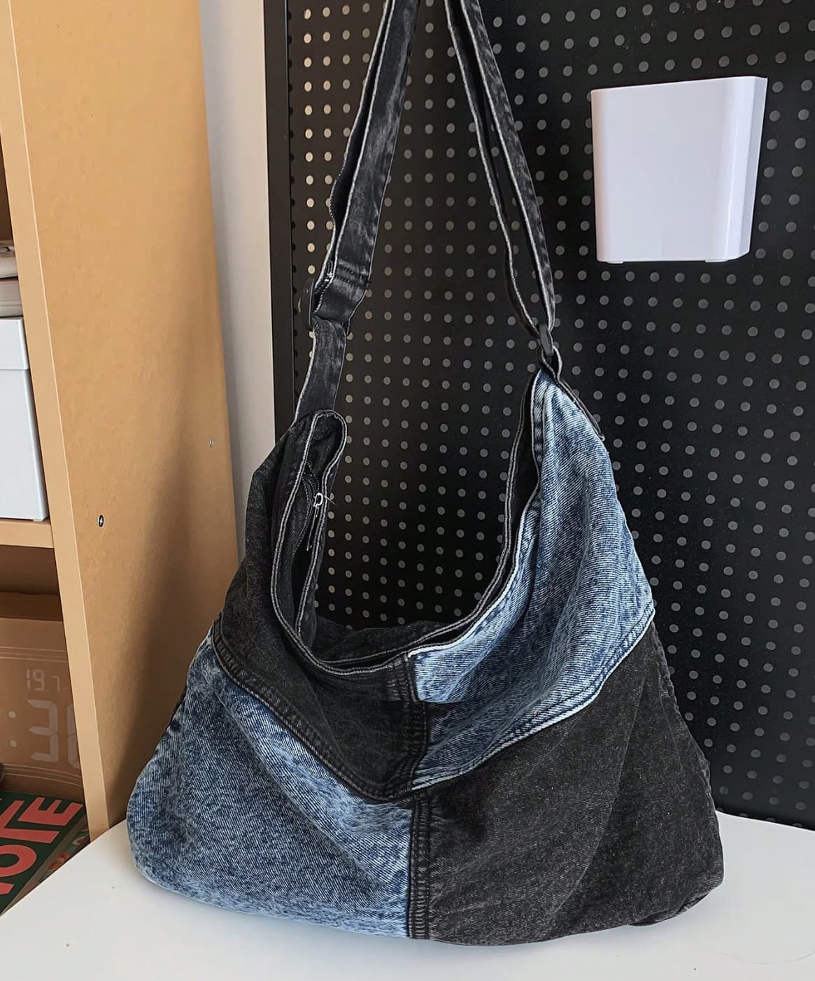 Two-tone patchwork denim sling tote bag with adjustable shoulder strap – measuring 40cm x 35cm x 13cm, perfect for everyday use. Lightweight yet spacious, ideal for college, shopping, and casual outings. A trendy pick for Gen Z fashion in India, exclusively at Tales of Totes – outshining Zouk, Chumbak, and other Indian tote brands with bold streetwear flair."

