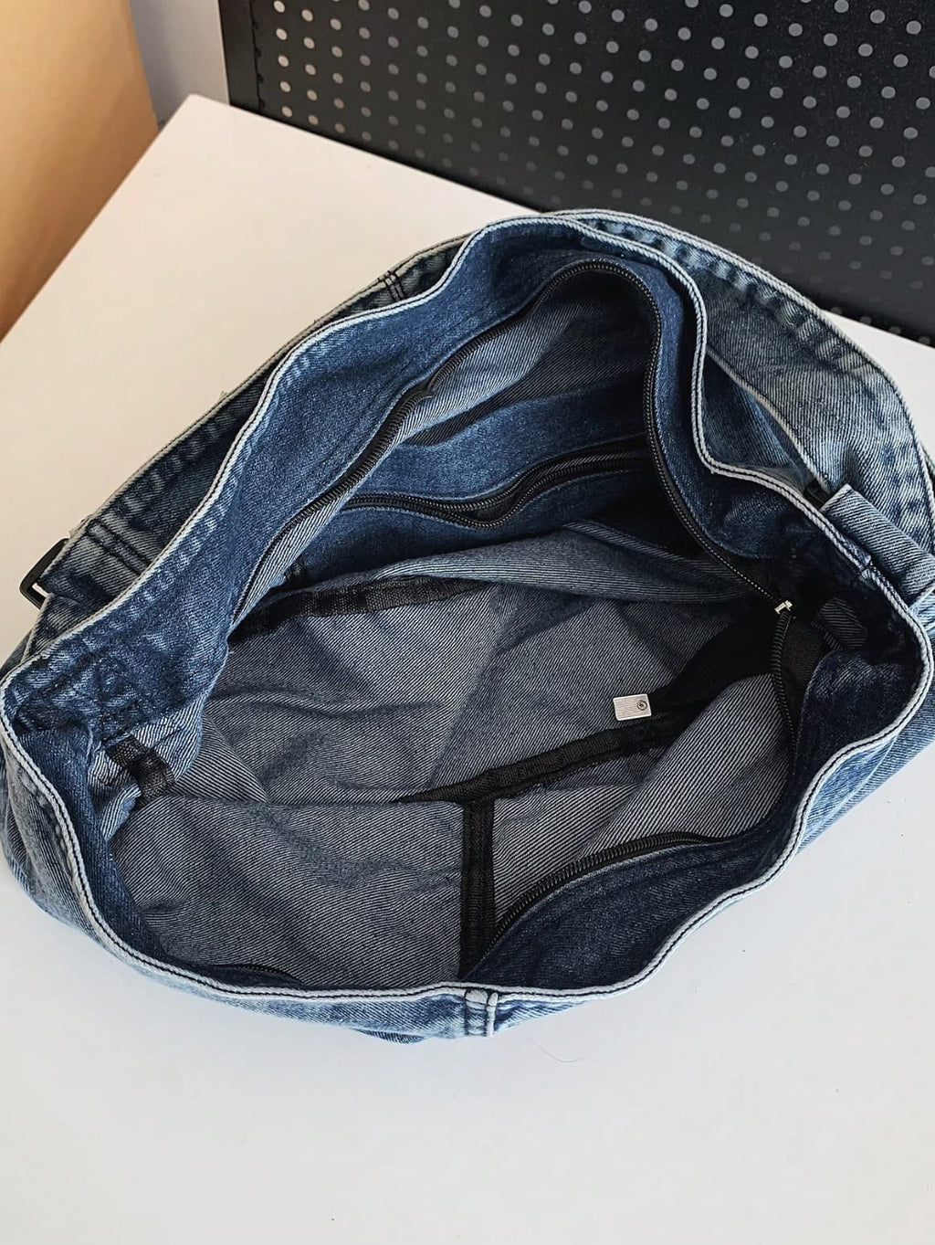 Two-tone patchwork denim sling tote bag with adjustable shoulder strap – measuring 40cm x 35cm x 13cm, perfect for everyday use. Lightweight yet spacious, ideal for college, shopping, and casual outings. A trendy pick for Gen Z fashion in India, exclusively at Tales of Totes – outshining Zouk, Chumbak, and other Indian tote brands with bold streetwear flair."

