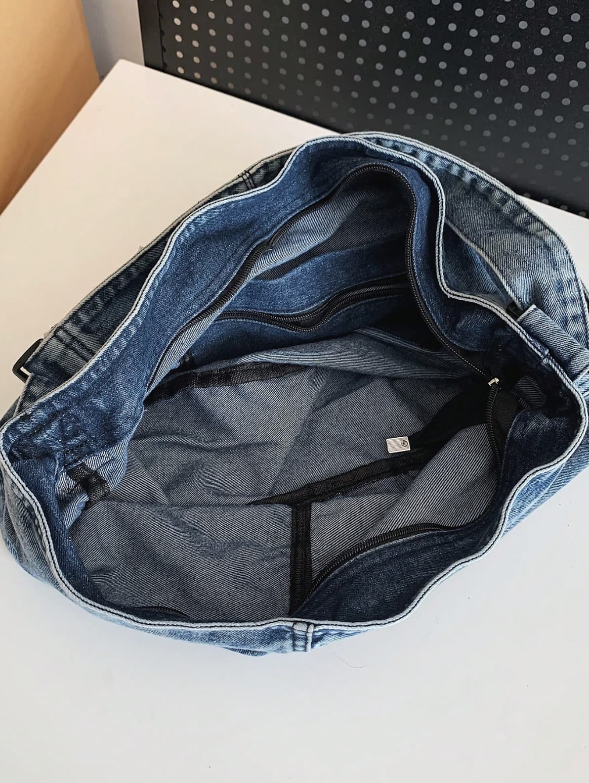 Two-tone patchwork denim sling tote bag with adjustable shoulder strap – measuring 40cm x 35cm x 13cm, perfect for everyday use. Lightweight yet spacious, ideal for college, shopping, and casual outings. A trendy pick for Gen Z fashion in India, exclusively at Tales of Totes – outshining Zouk, Chumbak, and other Indian tote brands with bold streetwear flair."

