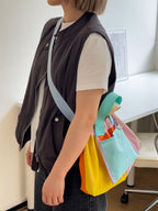 Trendy multi-color casual college tote bag with mesh detailing and adjustable straps.