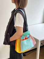 Trendy multi-color casual college tote bag with mesh detailing and adjustable straps.