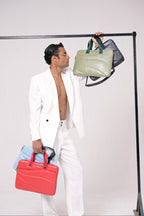 Person holding multiple bags against a white background