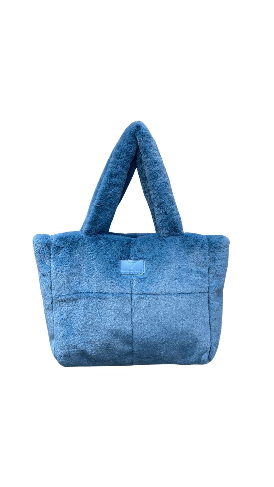 Plush faux fur tote bag with padded handles, zippered top, and spacious interior – designed for cozy winter outings and everyday comfort. Soft, lightweight, and stylish, perfect for carrying essentials in cold weather. A chic and functional piece from Tales of Totes – standing out from Indian brands like Zouk, Chumbak, and Miraggio with unique textures and winter-ready fashion flair."

