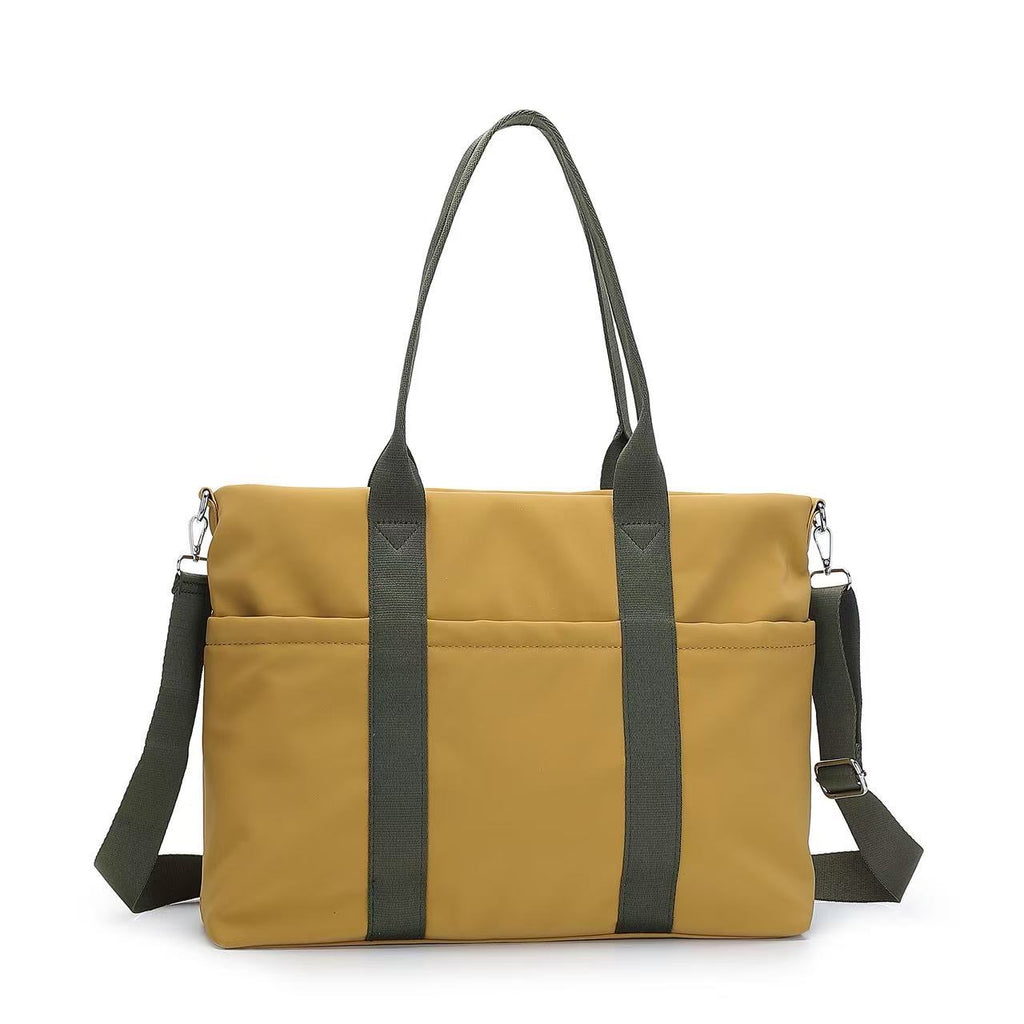 Yellow bag with black straps on a white background