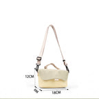 Compact, functional and made to stand out.

Designed for everyday movement, this crossbody bag pairs a clean, softly structured body with contrast utility details. The curved front flap keeps the silhouette minimal, while the bold webbing strap and knotted rope handle give it a sporty, technical edge.

Wear it crossbody for everyday errands, over the shoulder, or carry it by the rope handle when you want to switch things up. Lightweight and easy to style, it’s sized for your daily essentials without feeling