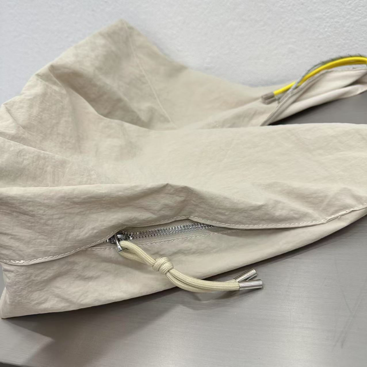 Beige fabric with a zipper on a gray background
