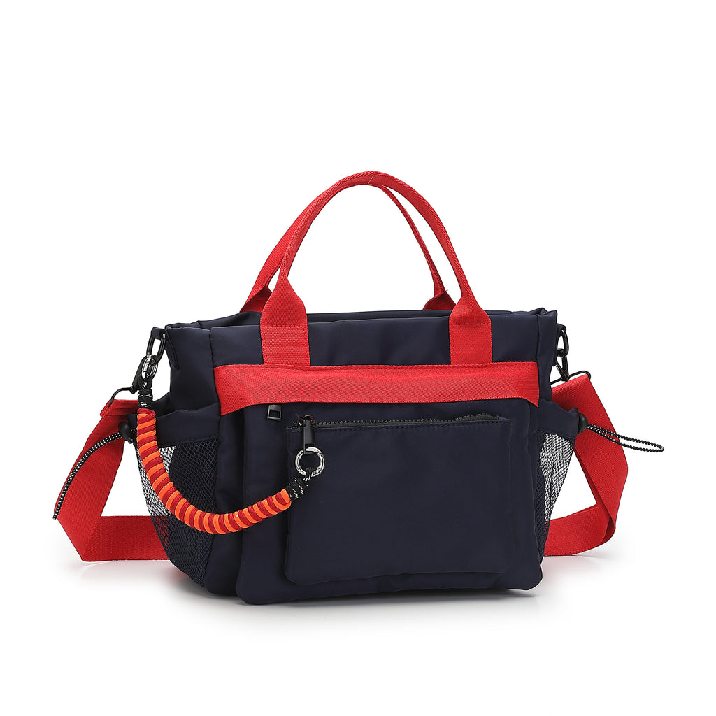 Black and red handbag with a coiled handle on a white background