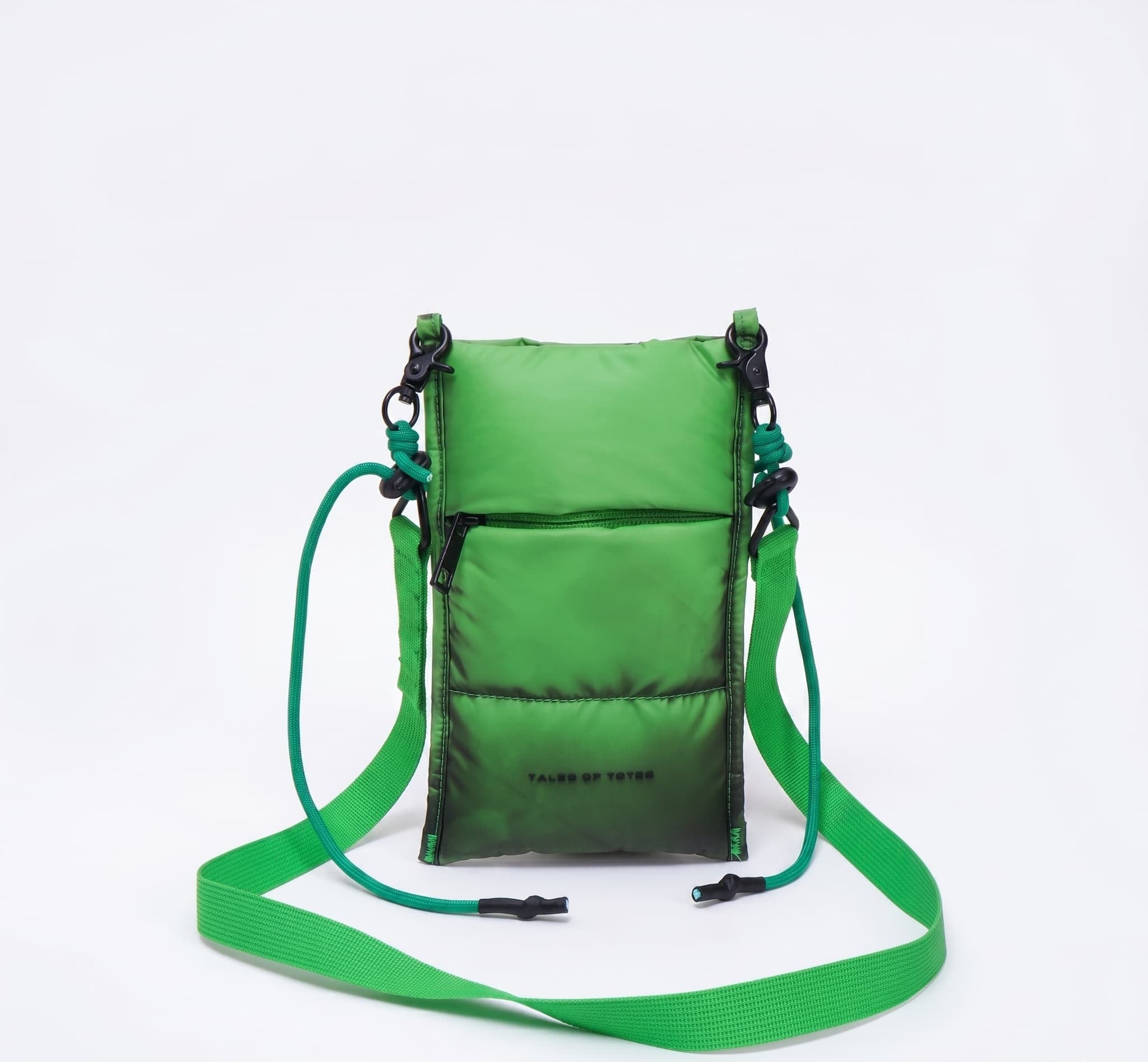 Green crossbody bag with a strap on a white background