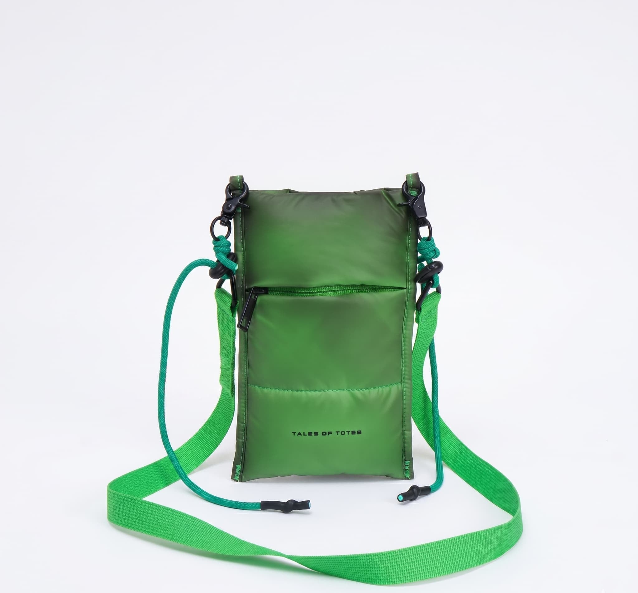 Green crossbody bag with a strap on a white background