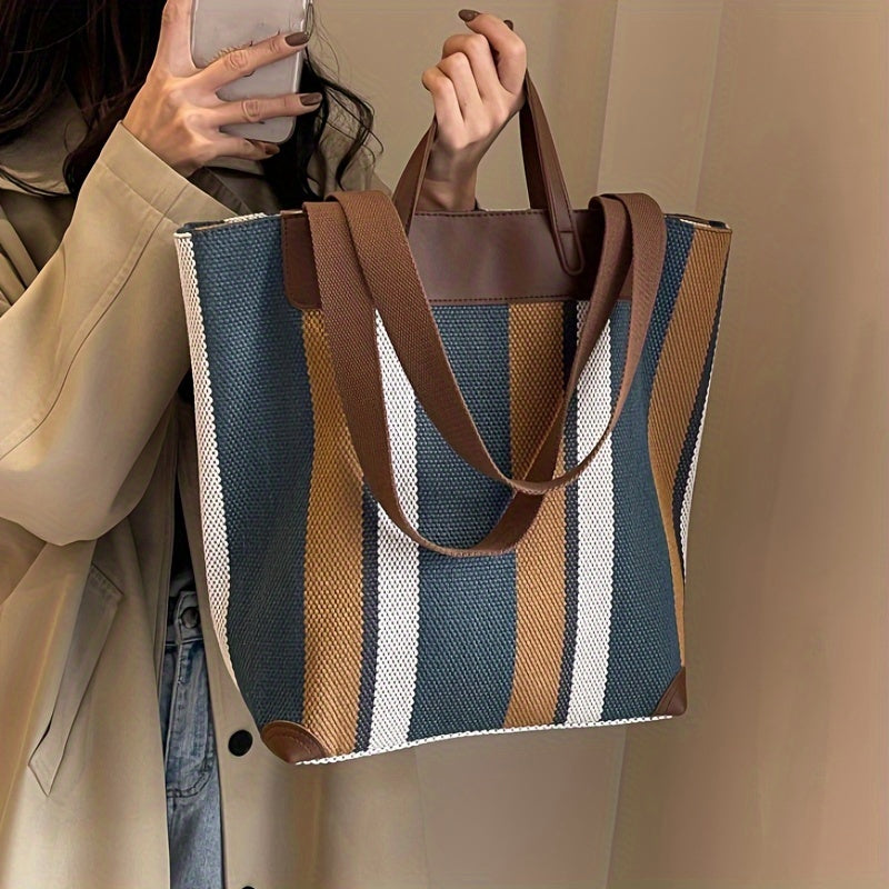 "Eco-friendly striped jute tote bag with dual handles – featuring bold black, grey, and white vertical patterns with leather-look accents and brown straps. Ideal for shopping, office, and casual outings. A sustainable and stylish choice from Tales of Totes – offering earthy, durable fashion accessories that stand apart from brands like Chumbak, Baggit, and DailyObjects in the Indian market."

