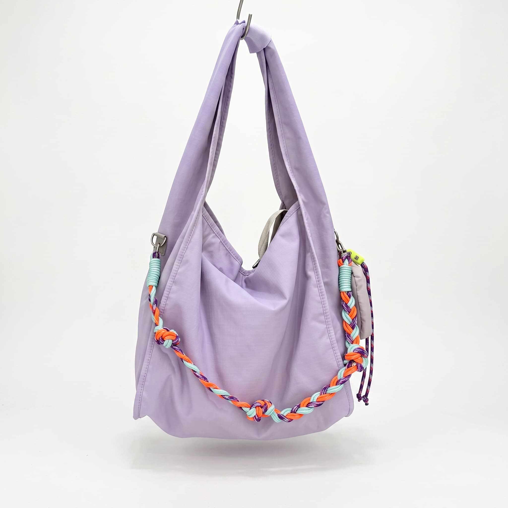 Waterproof nylon hobo bag with wide shoulder handle, removable braided crossbody strap and detachable mini pouch