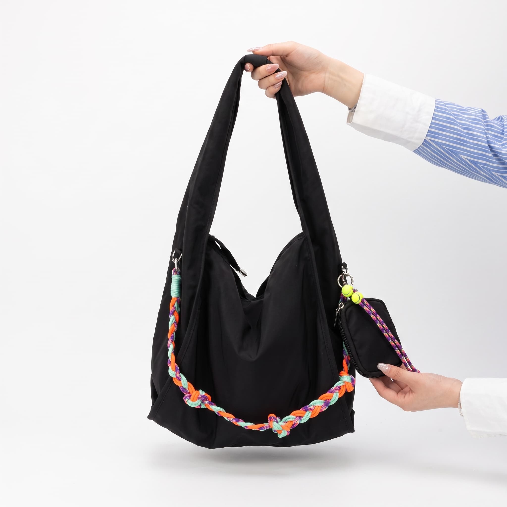 Waterproof nylon hobo bag with wide shoulder handle, removable braided crossbody strap and detachable mini pouch