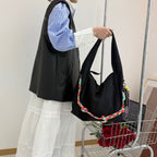 Waterproof nylon hobo bag with wide shoulder handle, removable braided crossbody strap and detachable mini pouch