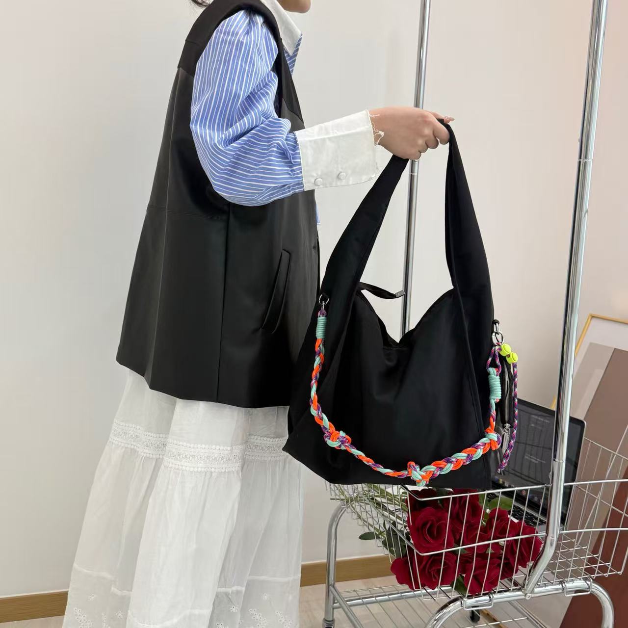 Waterproof nylon hobo bag with wide shoulder handle, removable braided crossbody strap and detachable mini pouch