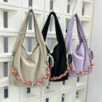 Waterproof nylon hobo bag with wide shoulder handle, removable braided crossbody strap and detachable mini pouch

That describes the product clearly while naturally including useful search terms like waterproof nylon, hobo bag, shoulder bag, crossbody strap, and mini pouch.