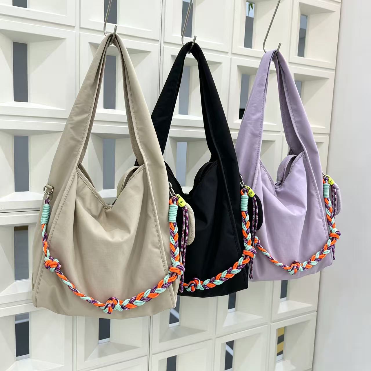 Waterproof nylon hobo bag with wide shoulder handle, removable braided crossbody strap and detachable mini pouch

That describes the product clearly while naturally including useful search terms like waterproof nylon, hobo bag, shoulder bag, crossbody strap, and mini pouch.