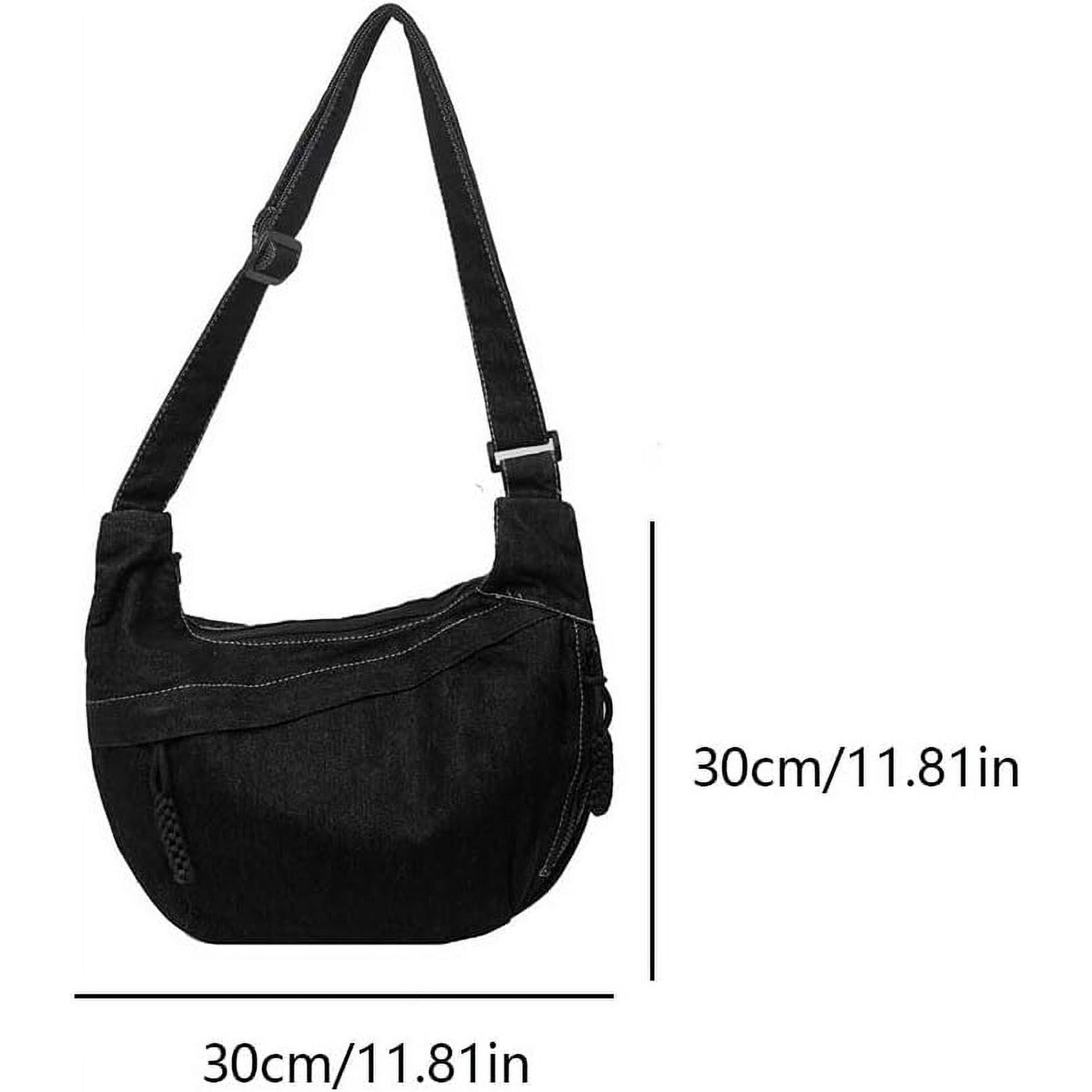 Minimal tote bag designed for urban Indians, perfect for college, travel, and casual wear Unisex black denim sling tote bag with zip pocket, hanging on orange street pole, stylish and spacious for Indian streetwear

