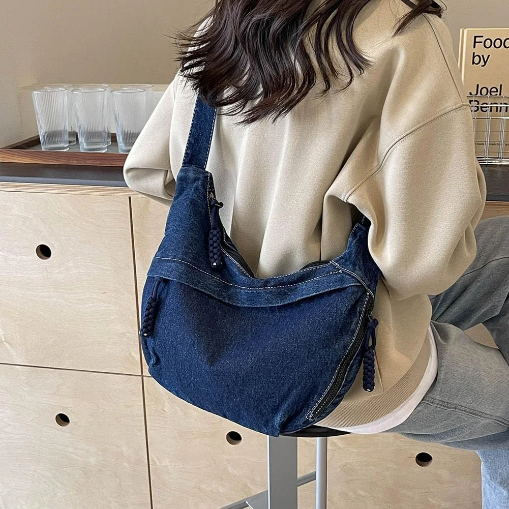 Everyday denim sling bag for women, styled with beige sweatshirt and relaxed jeans, streetwear essentials