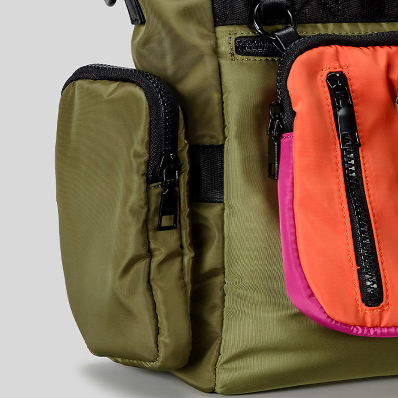 Green and multicolored pouches with zippers on a light gray background