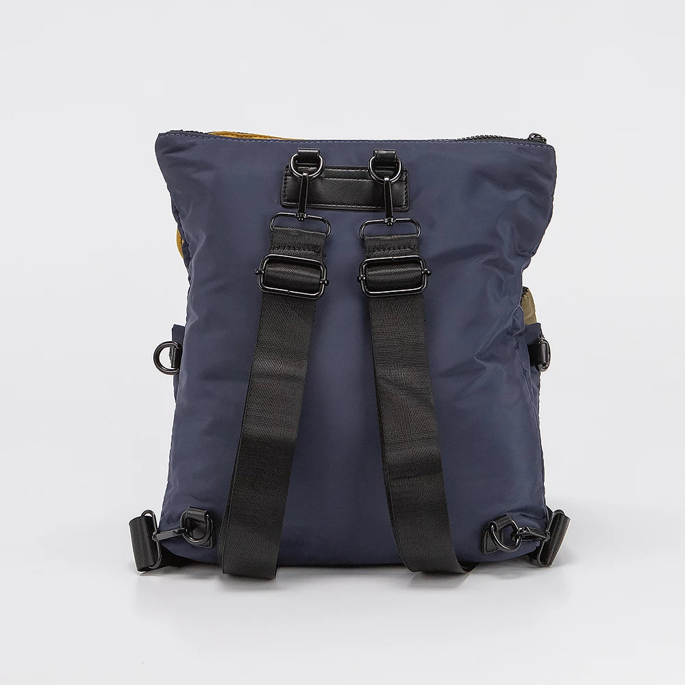 Blue backpack with black straps on a light gray background