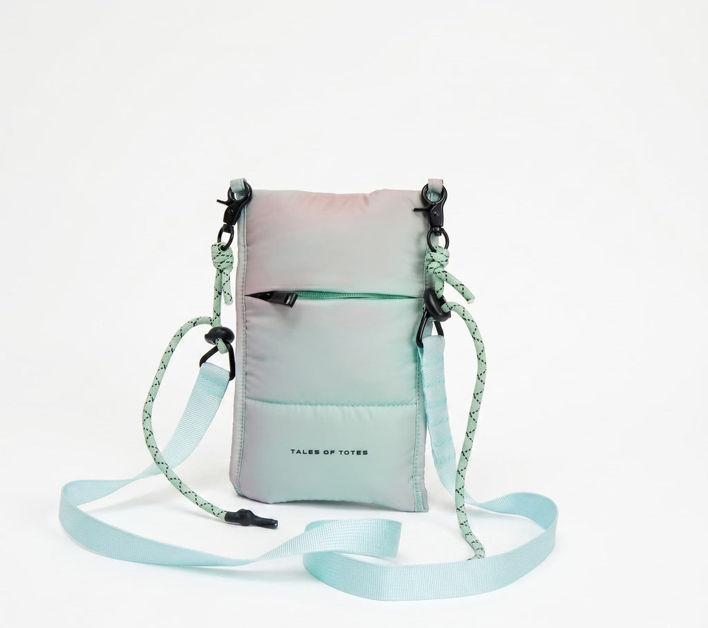 Gradient crossbody bag with a strap on a white background