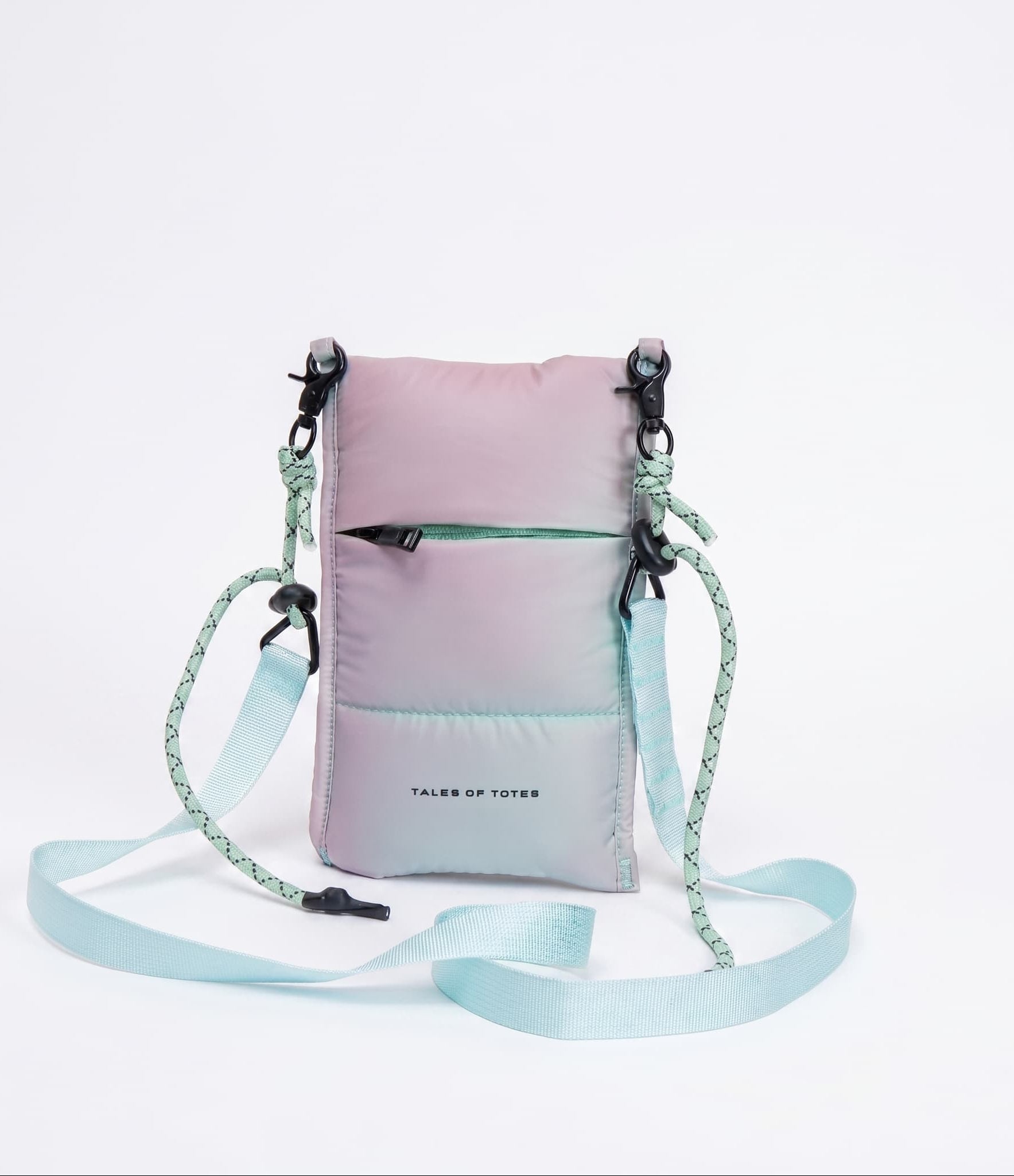 Gradient pink to blue crossbody bag with a strap on a light gray background